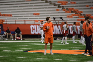 Syracuse quarterback Eric Dungey missed Saturday's game due to injury. He warmed up before the contest though.