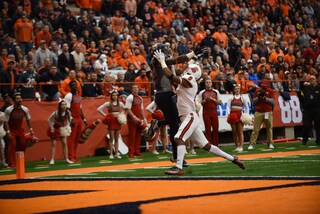 Alvin Cornelius elevates above a Wolfpack defender. He made four catches for 61 yards on the day.